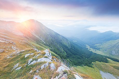 The Chiarino Valley, one of the great valleys of the Gran Sasso Mountains, at sunset. Gran Sasso and Monti della Laga national park, Abruzzo, Italy The Chiarino Valley, one of the great valleys of the Gran Sasso Mountains, at sunset. Gran Sasso and Monti della Laga national park, Abruzzo, Italy