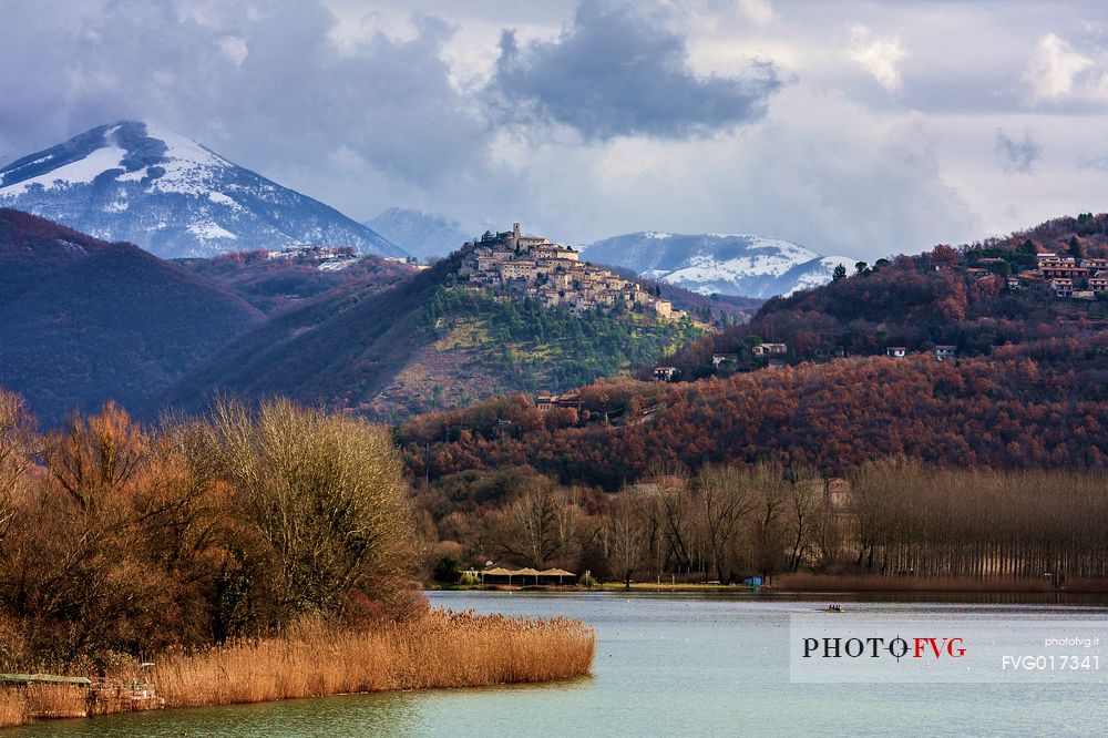 The ancient medieval village of Labro, in  Rieti's province, Lazio. On the background  mountains, covered by snow. Piediluco's lake waters in foreground.