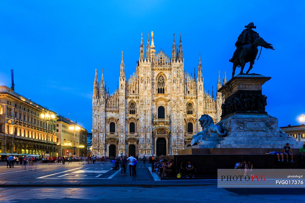 Plaza of the Cathedral in Milan at the blue hour with the monument to Vittorio Emanuele II in the foreground