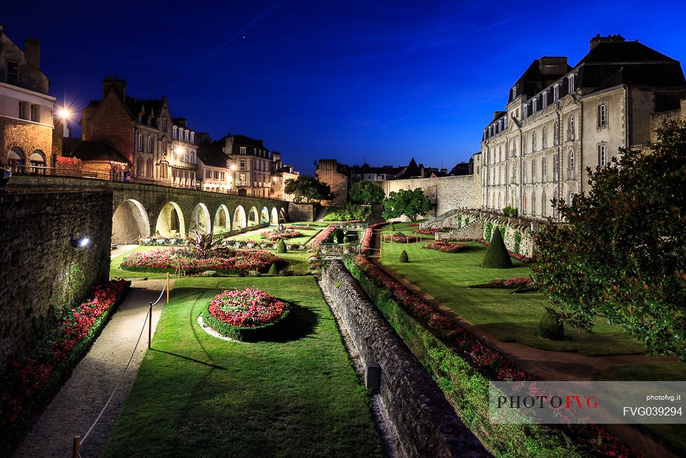 The famous gardens next to the medieval walls of the city of Vannes and in the background the Chateau de l'Hermine castle, Brittany, France, Europe