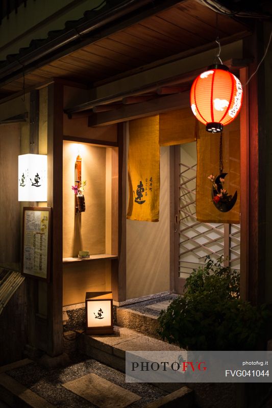 Night image of a street in the historic district of Gion with its characteristic colored paper lamps, Kyoto, Japan