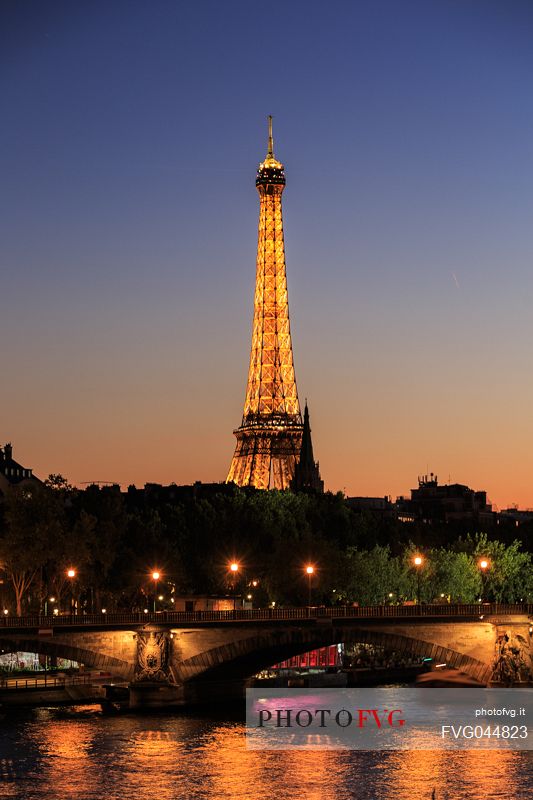 The Eiffel tower and the Seine at twilight from the Alexander III bridge, Paris, France, Europe