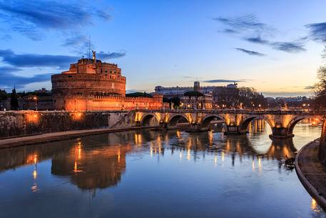 Castel Sant'Angelo and the bridge Sant'Angelo illuminated with the blue sky before the dawn
