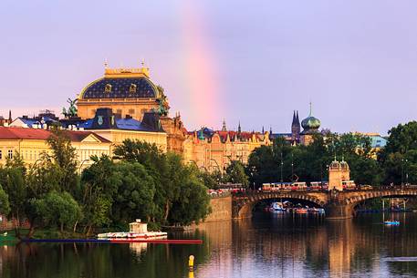 Prague, view across Vltava River and Charles Bridge at sunset with rainbow

