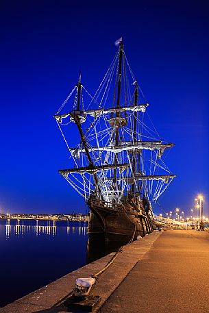Night view ot the ancient sailing ship in the porto of Saint Malo town, Brittany, France, Europe