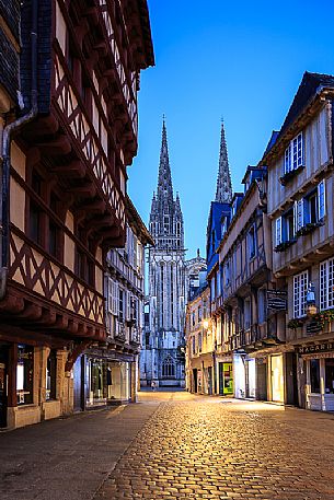 View of the bell tower of Saint Corentin cathedral and the old house of Quimper, capital of French Cornwall, Britanny, France, Europe