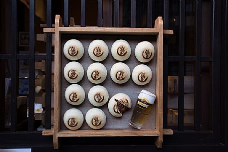 Detail of a bulletin board showing a local product in the historical district of the city of Takayama, in the center of the island of Honshu, Japan.