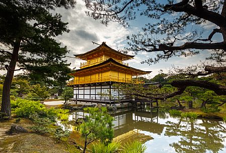 Kinkaku-ji or golden pavilion temple is Japan's most famous leading temples, World Cultural Heritage featuring a shining golden pavillion reflected in a lake, Kyoto, Japan