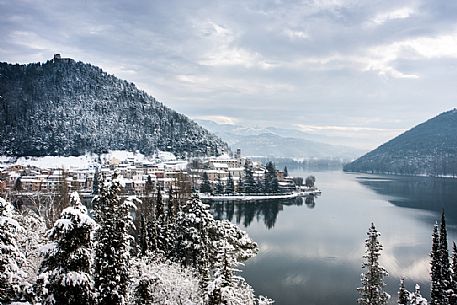Overview of Piediluco lake and the village covered with snow on a winter day, Umbria, Italy, Europe