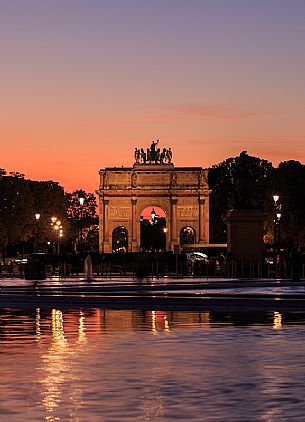 Triumphal arch of the Carrousel seen from the square of the Louvre at sunset, Paris, France, Europe