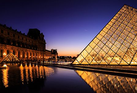 Sunset lights at the Louvre square with the glass pyramid, Paris, France, Europe