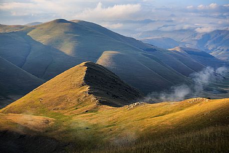 Panorama of the Sibillini mountains near Castelluccio di Norcia at sunset, Umbria, Italy, Europe