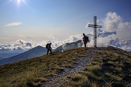 Hikers on top of Pizzo Tre Vescovi peak where you can enjoy a 360  view of the central Apennines, Sibillini national park, Marche, Italy, Europe