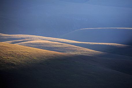 Grazing light on the profiles of the mountains
of Castelluccio di Norcia, Umbria, Italy