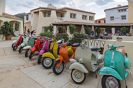 This picture resembles some of the most italian icons Vesp, the notorious scooter by Piaggio. Porto Cervo, one of the most famous and classy  destinations in Sardinia. Italy