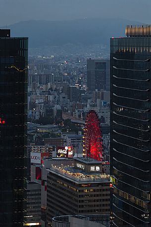 View of the worlds first Ferris wheel directly connected to a building and resistant to earthquake in the central part of Osaka, Japan