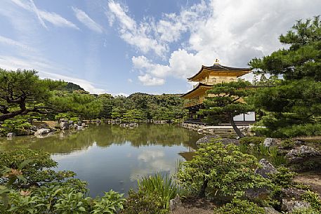 Kinkaku-ji or golden pavilion temple is Japan's most famous  leading temples, World Cultural Heritage featuring a shining golden pavillion riflected in a  centered lake, kyoto, Japan