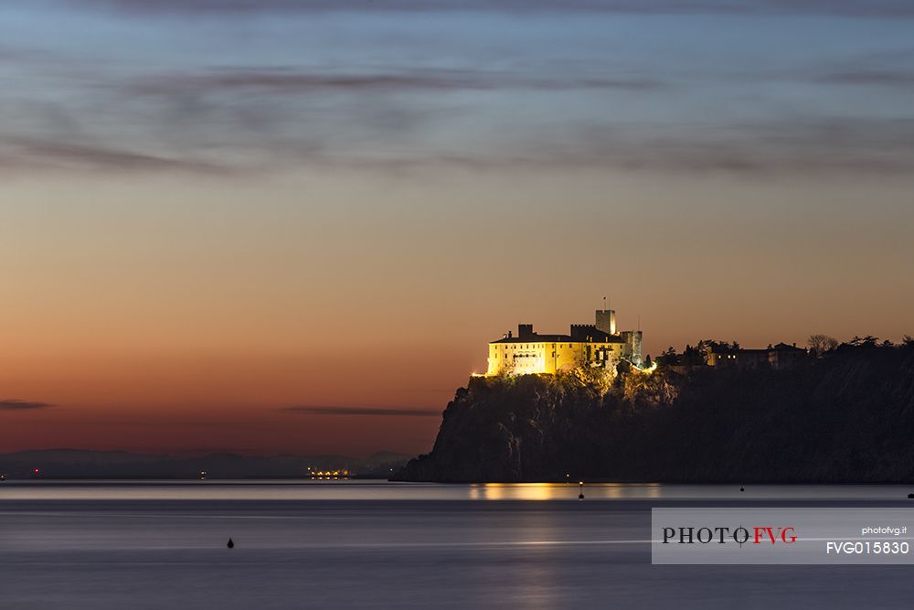 View of Duino's castle from Portopiccolo after the sunset