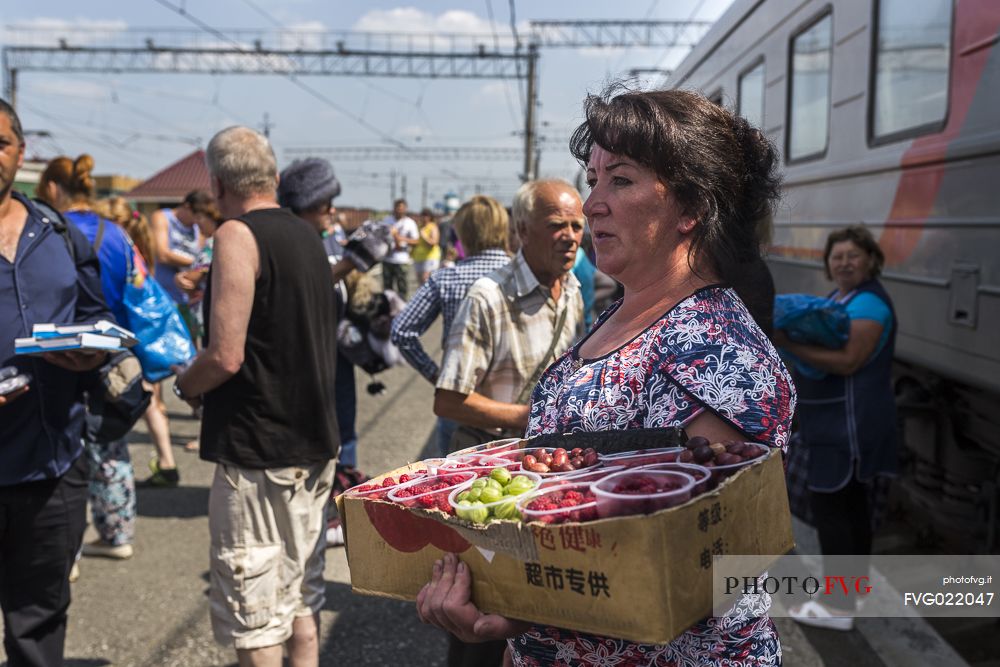 babushka, one of some women selling food in the stations where transiberian trains stop for a couple of minutes.