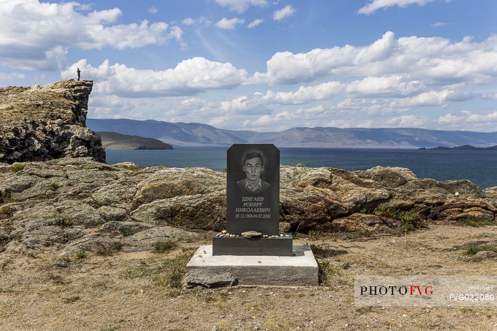 A tombstone of an unlucky young boy that died on the cliff on the Lake Bajkal in the nearby of the ferry that brings people on Olkhon Island, Siberia, Russia