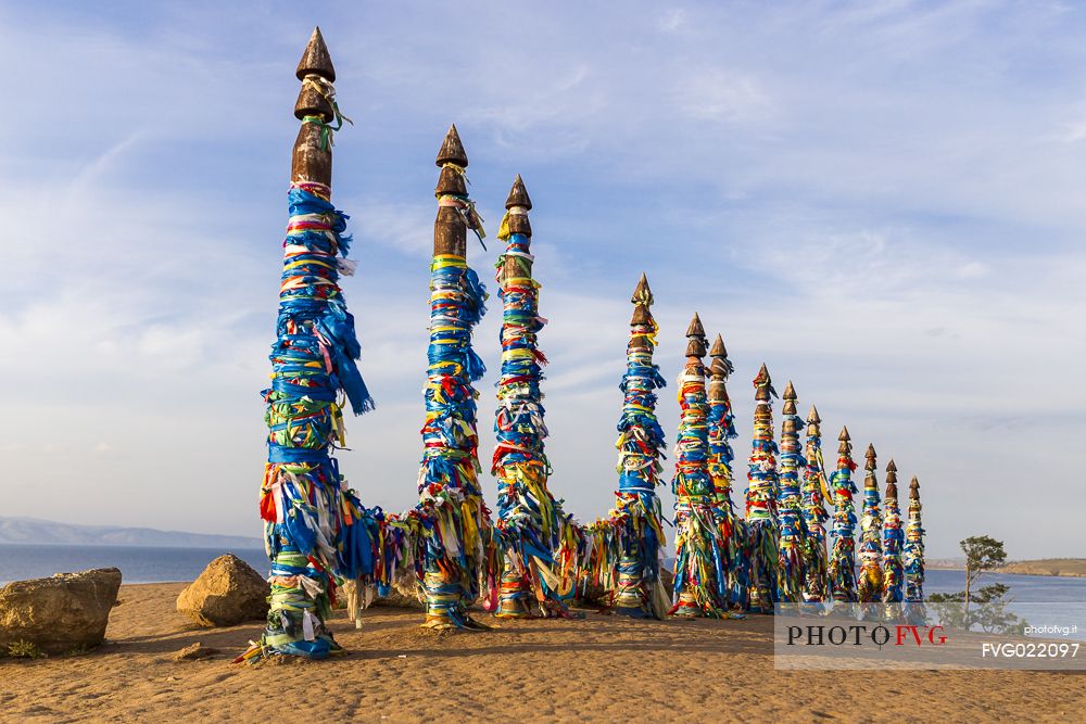 Shaman wooden pillars with colored cloth on Olkhon island, Bajkal lale, Russia
