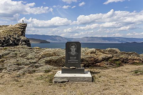 A tombstone of an unlucky young boy that died on the cliff on the Lake Bajkal in the nearby of the ferry that brings people on Olkhon Island, Siberia, Russia
