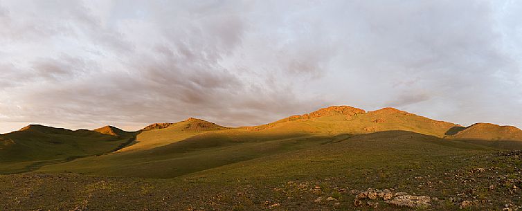 A panoramic view of the sunrise in the mongolian steppe, Mongolia A panoramic view of the sunrise in the mongolian steppe, Mongolia