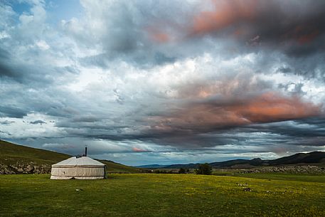 Sunset above a typical nomadic mongolian tent, a 
