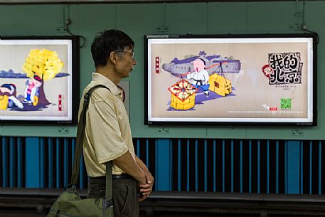 A man waiting for the subway in Beijing