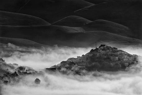 the plateau of Castelluccio di Norcia, Umbria, Italy, in the summer turns to the flourishing of many different species of flowers.