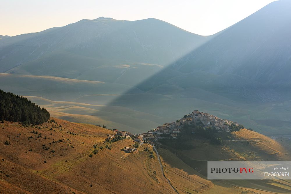 The old village of Castelluccio di Norcia before the disastrous earthquake of 2016 and  in the background the fields planted with lentil, Sibillini National park, Umbria, Italy, Europe
