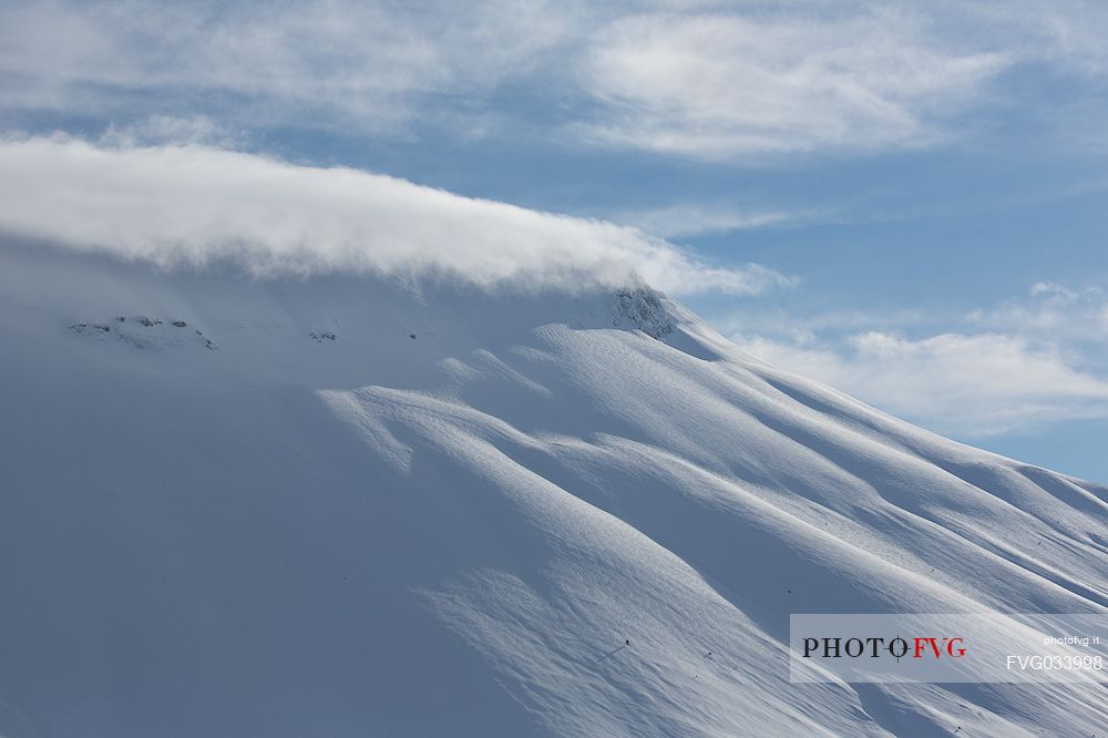 The Vettore mount with a hat of clouds in a beautiful winter day, Castelluccio, Sibillini National Park, Umbria, Italy, Europe