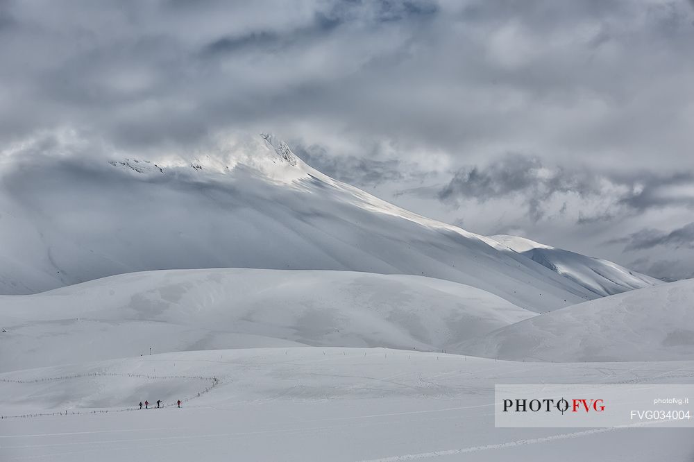 A group of skiers in the slopes of Mount Vettore, Castelluccio, Sibillini National Park, Umbria, Italy, Europe