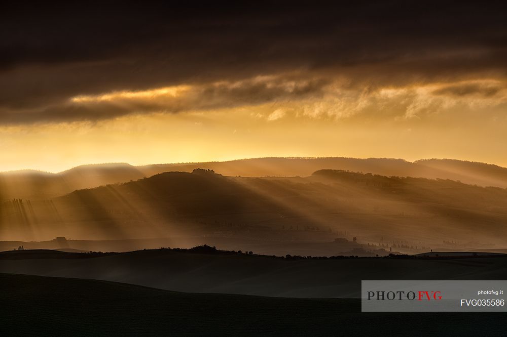The beauty of the hills in Val d'Orcia at sunset, Tuscany, Italy, Europe