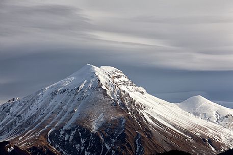 A clearing snowstorm reveal the peaks of the Gran Sasso mountain range, Gran Sasso and monti della Laga national park, Abruzzo, Italy