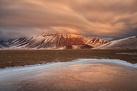 View of the Pian Grande of Castelluccio di Norcia, in the background the Vettore mountain at dawn, Sibillini National Park, Umbria, Italy, Europe