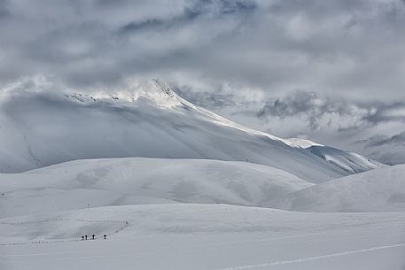 A group of skiers in the slopes of Mount Vettore, Castelluccio, Sibillini National Park, Umbria, Italy, Europe