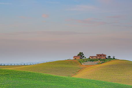 The beauty of the hills in Val d'Orcia, ridges and farmhouses typical of Tuscan beauties, Pienza, Orcia valley, Tuscany, Italy, Europe