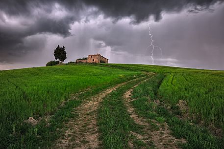Thunderstorm over the old farmhouse in the Orcia valley, Tuscany, Italy, Europe