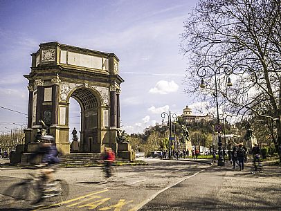 Urban scene with Arco di Trionfo arch in the Park of Valentino and in the background the Cappuccini mount, Turin, Piedmont, Italy, Europe
