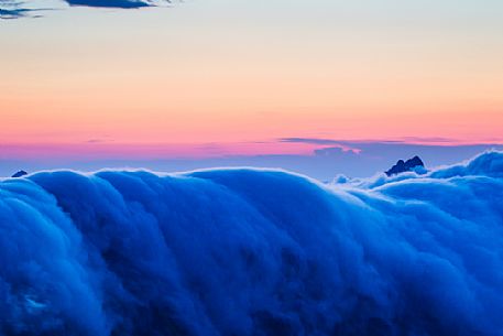 Fall of clouds at sunset in the Apuane alps, Penna di Sumbra mount, Tuscany, Italy, Europe