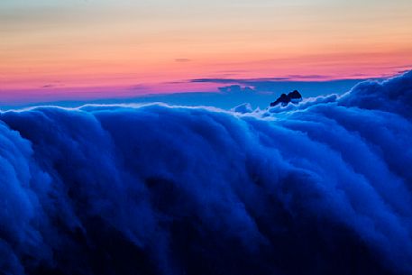 Fall of clouds at sunset in the Apuane alps, Penna di Sumbra mount, Tuscany, Italy, Europe