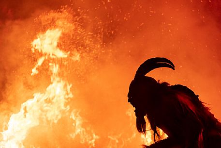 Silhouette of Krampus in the flames, Christmas devils, Tarvisio, Friuli Venezia Giulia, Italy, Europe