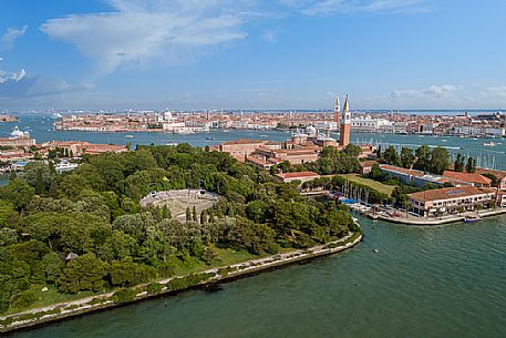 Shot from above of the island of San Giorgio, in the foreground the Green Theater, in the background San Marco and all its basin