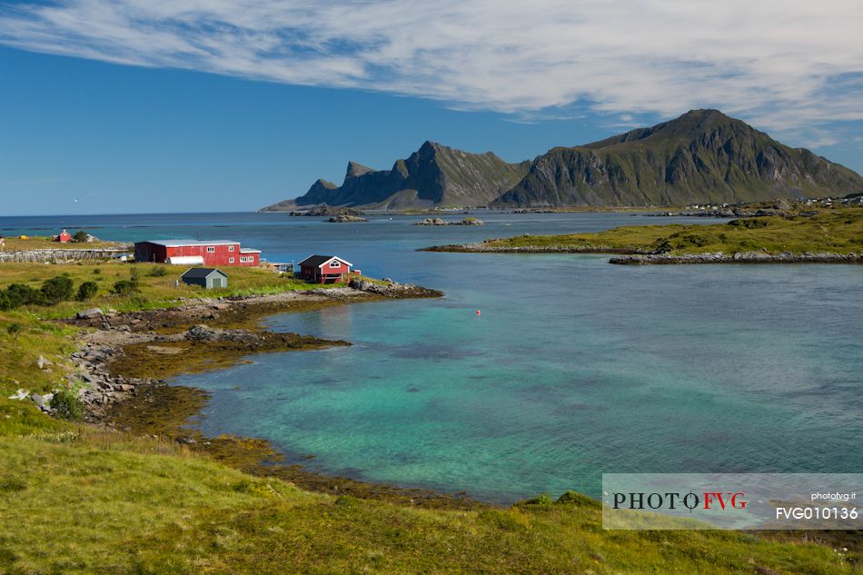 the homes of Norwegian fishermen overlook the turquoise sea