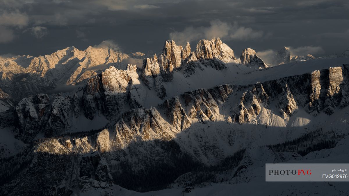Overview of the Croda da Lago and Lastoi de Formin mountains illuminated by the sun after a heavy snowfall, view from the Lagazuoi refuge, Falzarego, Cortina d'Ampezzo, dolomites, Italy, Europpe