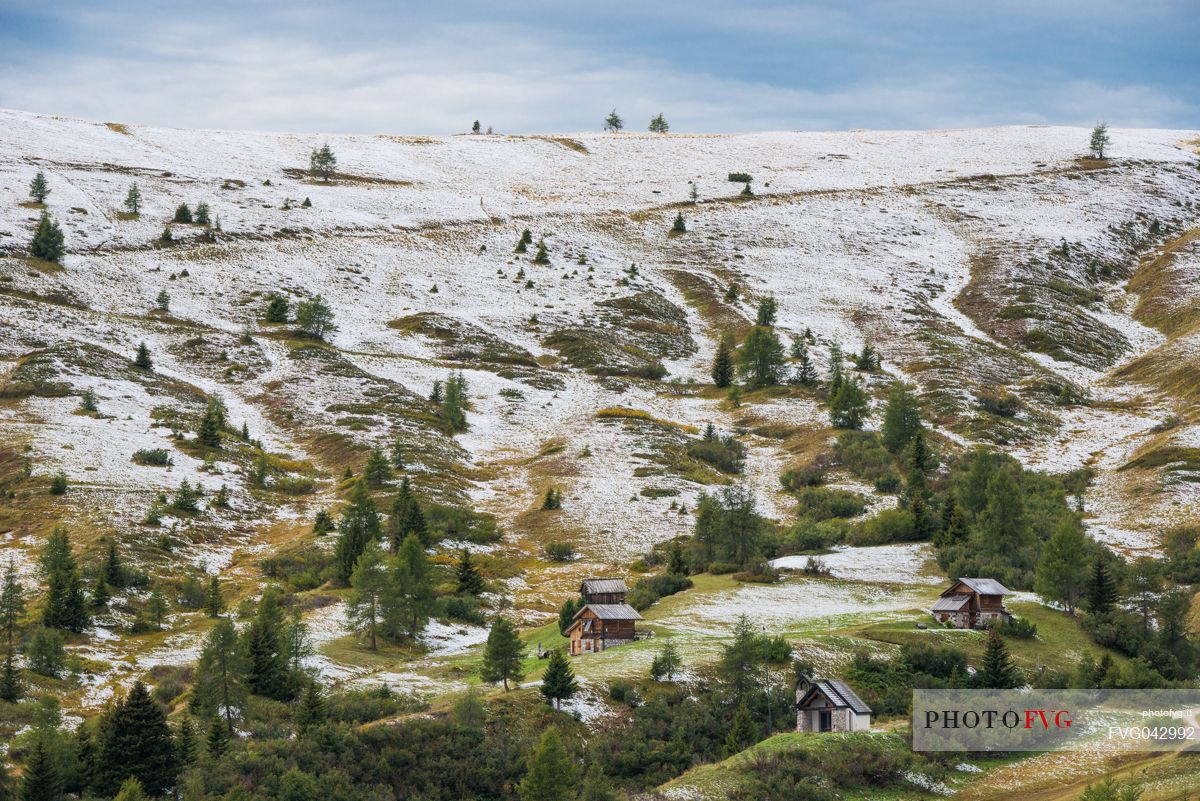 Meadows of the Giau pass partly covered by a dusting of snow, dolomites, Cortina d'Ampezzo, Veneto, Italy