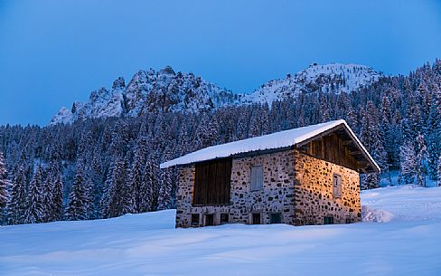 Mountain hut near Passo Cereda in a winter night, Trentino Alto Adige, Italy, Europe