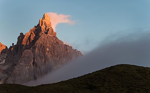 Cimon de la Pala wrapped by clouds during summer sunset, dolomites, Trentino Alto Adige, Italy, Europe