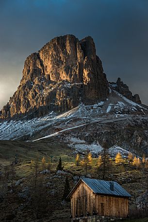 Sunset on Mount Averau and on a small hut below, Giau pass, dolomites, Cortina d'Ampezzo, Veneto, Italy, Europe